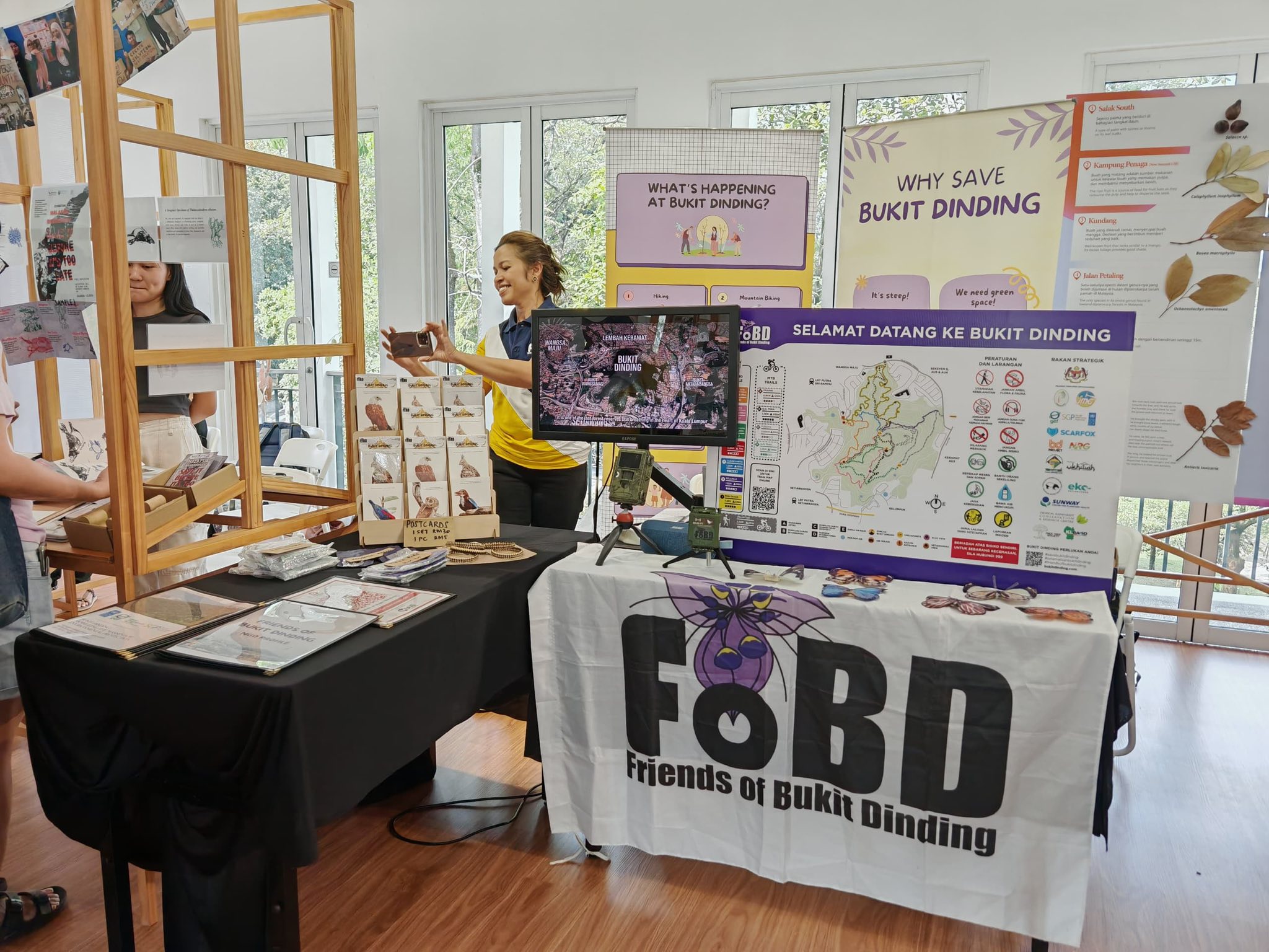 FoBD outreach booth with maps, educational displays, and postcards.